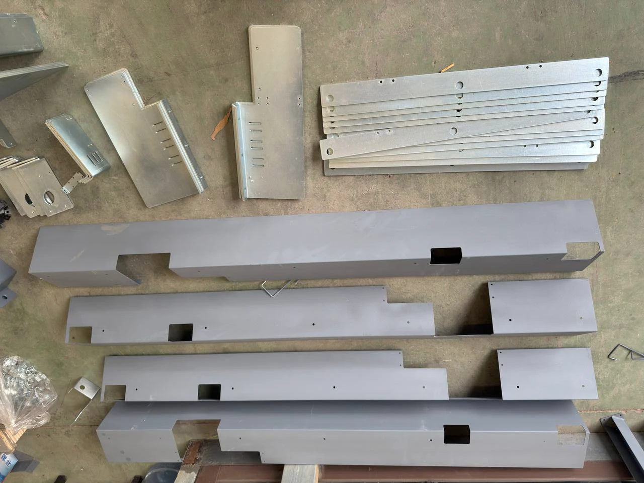 Formed sheet-metal panels and stacked strips with cutouts and mounting holes